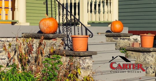 Fall decorations on the porch of a residential home.
